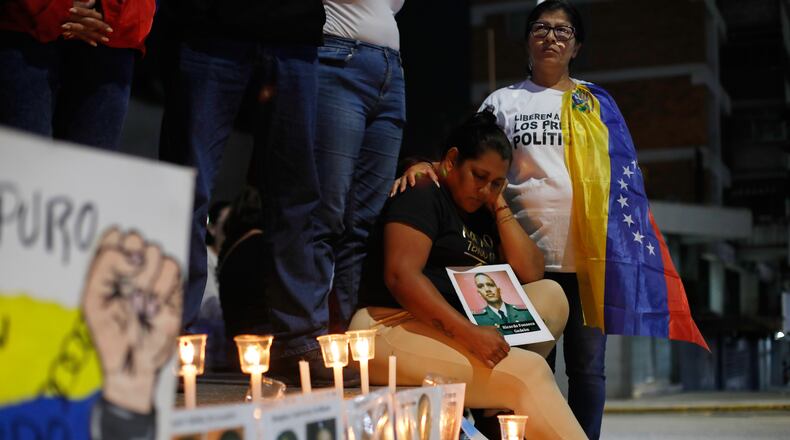 Relatives of detainees they say are held for political reasons wait outside El Helicoide, headquarters of Venezuela's intelligence service and a detention center, after the National Assembly approved an amnesty bill in Caracas, Venezuela, Thursday, Feb. 19, 2026. (AP Photo/Crisitian Hernandez)