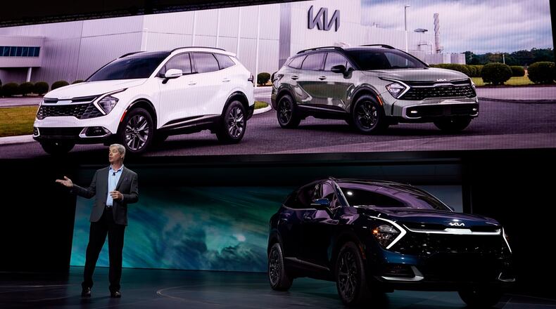 Russell Wager, Vice President of Marketing for Kia America, introduces the Kia Sportage HEV at the AutoMobility LA auto show Wednesday, Nov. 17, 2021, in Los Angeles. (AP Photo/Marcio Jose Sanchez)