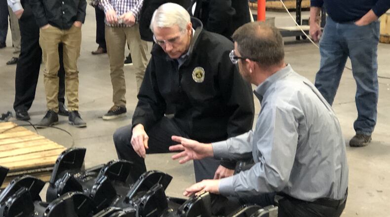 Sen. Rob Portman toured Fecon manufacturing facilities in Lebanon on Friday before answering question about the impeachment trial of President Donald Trump. STAFF/LAWRENCE BUDD