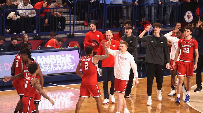 Dayton's De'Shayne Montgomery slaps hands with Will Maxwell at the end of the first half of a game against Duquesne on Tuesday, Jan. 13, 2026, at the UPMC Cooper Fieldhouse in Pittsburgh. David Jablonski/Staff
