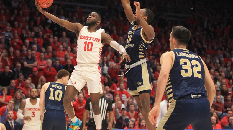 Dayton’s Jalen Crutcher shoots against George Washington on Saturday, March 7, 2020, at UD Arena. David Jablonski/Staff