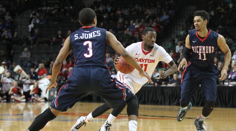 Dayton’s Scoochie Smith cuts through two Richmond defenders in the quarterfinals of the Atlantic 10 tournament on Friday, March 11, 2016, at the Barclays Center in Brooklyn, N.Y. David Jablonski/Staff
