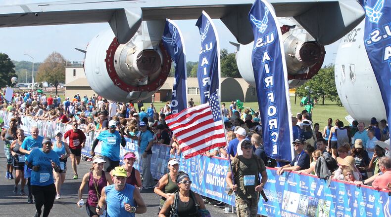 Runners finish at the 22nd annual Air Force Marathon on Saturday, Sept. 15, 2018, at Wright-Patterson Air Force Base. Northwestern High School graduate and former Wright State runner Jacob McCubbin, 28, won the men s race, and Sarah Bishop, 36, a mother of four who attended high school in Alaska and ran track at Auburn, won the women's race. The event attracted thousands of runners from all 50 states and eight countries. (David Jablonski/Staff)