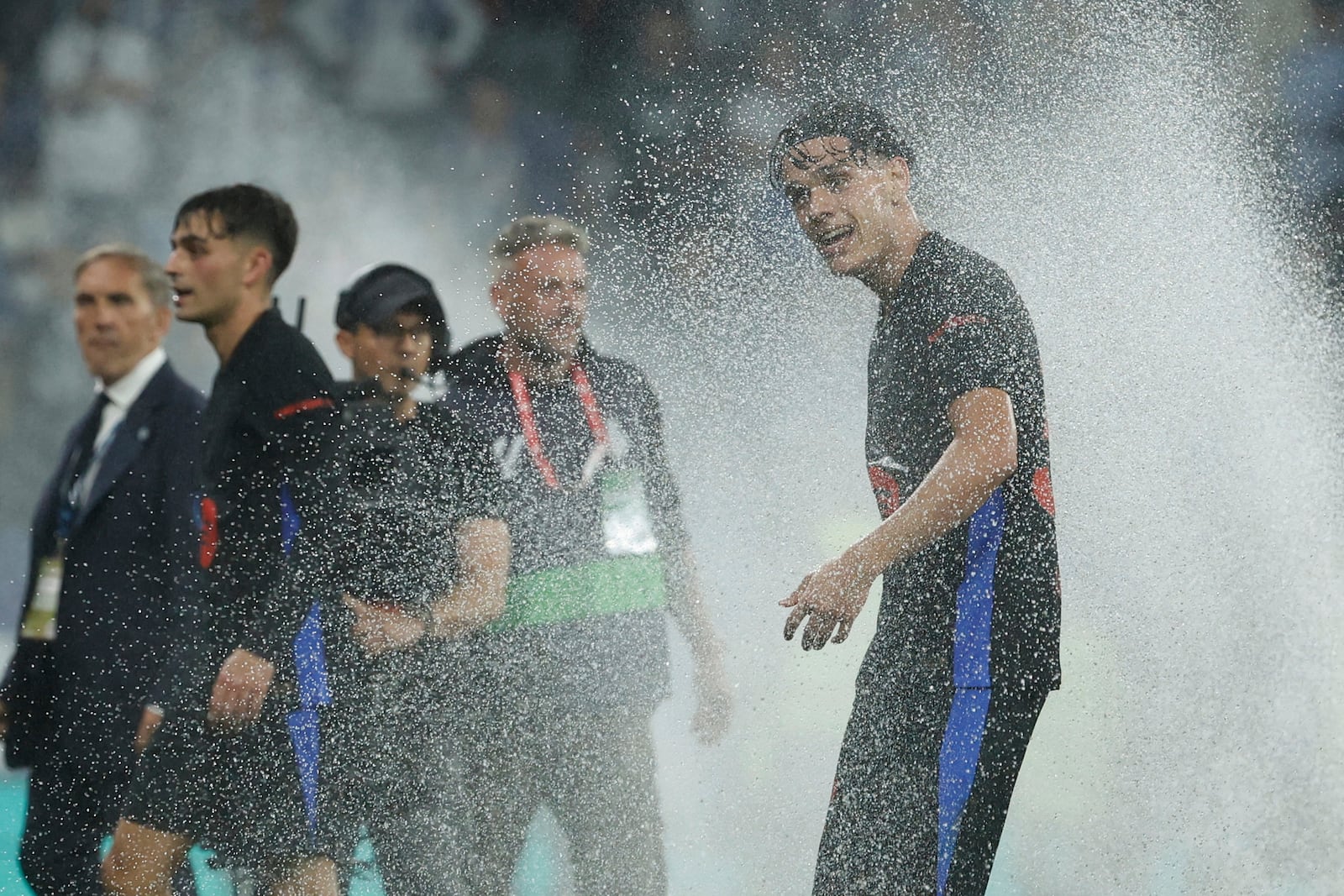Barcelona's Hector Fort celebrates at the end of the Spanish La Liga soccer match between Barcelona and Espanyol at Lluis Companys Olympic Stadium in Barcelona, Spain, Thursday, May 15, 2025. (AP Photo/Joan Monfort)