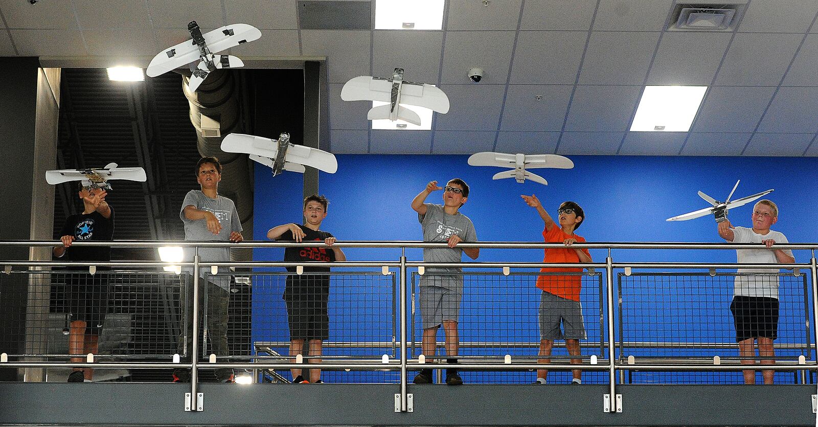 A group of middle school students fly paper airplanes Thursday, June 13, 2024 that they made during the first career camp for middle school students at the Greene County CTC. A total of 85 students signed up for the camp. MARSHALL GORBY\STAFF





