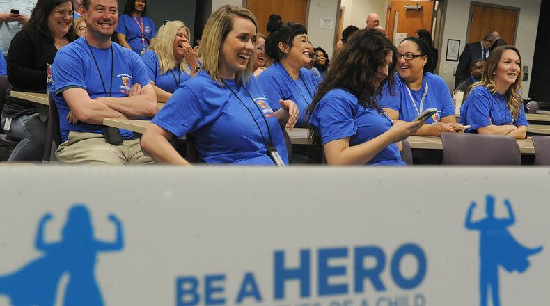 Officials and staff dressed in blue Wednesday April 13, 2022 at the Haines Children's Center for “Wear Blue Day” to bring awareness to the issue of child abuse. Montgomery County officials hosted an event at the center to show appreciation for caseworkers and other employees who work on the front lines to stop child abuse. MARSHALL GORBY\STAFF