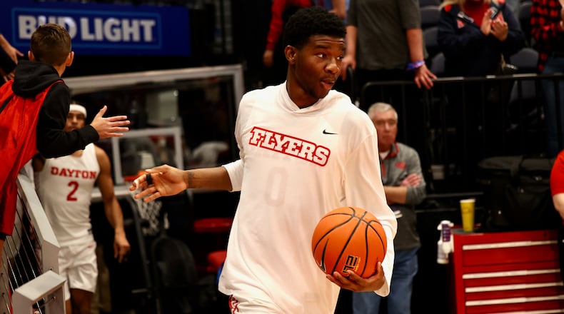 Dayton's Tyrone Baker runs out of the tunnel and takes the court before a game against Capital on Oct. 29, 2022, at UD Arena. David Jablonski/Staff