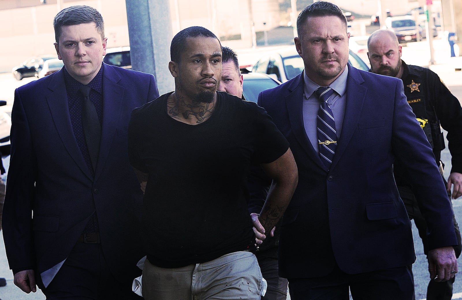 Members of the Montgomery Sheriff's Department escort homicide suspect Sha'king Jones last week to the Montgomery Jail. MARSHALL GORBY\STAFF