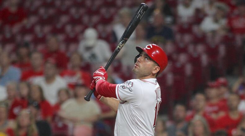 The Reds' Joey Votto swings during a game against the Brewers on July 2, 2019, at Great American Ball Park in Cincinnati.
