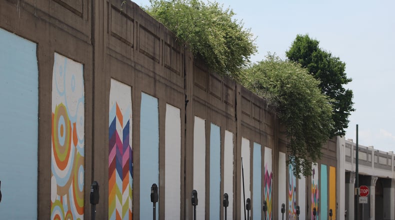 A 21-panel mural on Stone Street near the Oregon District in downtown Dayton will liven up a bland section of the urban landscape. CORNELIUS FROLIK / STAFF