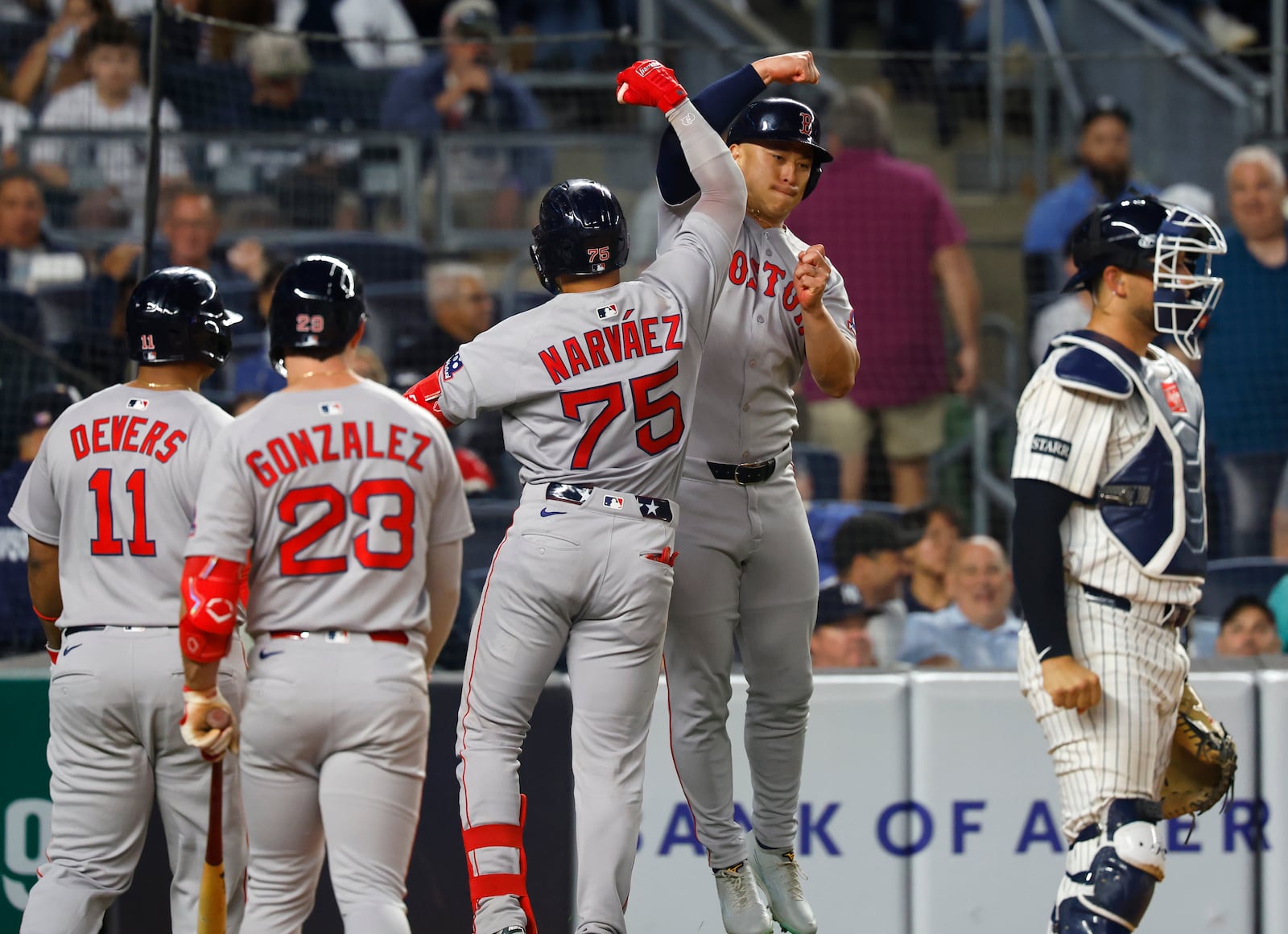 Boston Red Sox's Carlos Narváez (75)celebrates with Rob Refsnyder after hitting a home run against the New York Yankees during the sixth inning of a baseball game, Sunday, June 8, 2025, in New York. (AP Photo/Noah K. Murray)