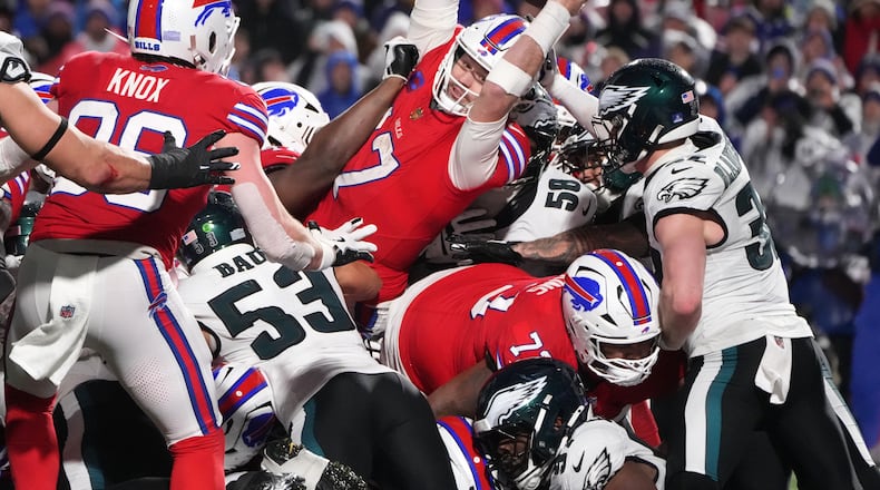 Buffalo Bills' Josh Allen (17) scores a touchdown during the second half of an NFL football game against the Philadelphia Eagles, Sunday, Dec. 28, 2025, in Buffalo, N.Y. (AP Photo/Gene J. Puskar)