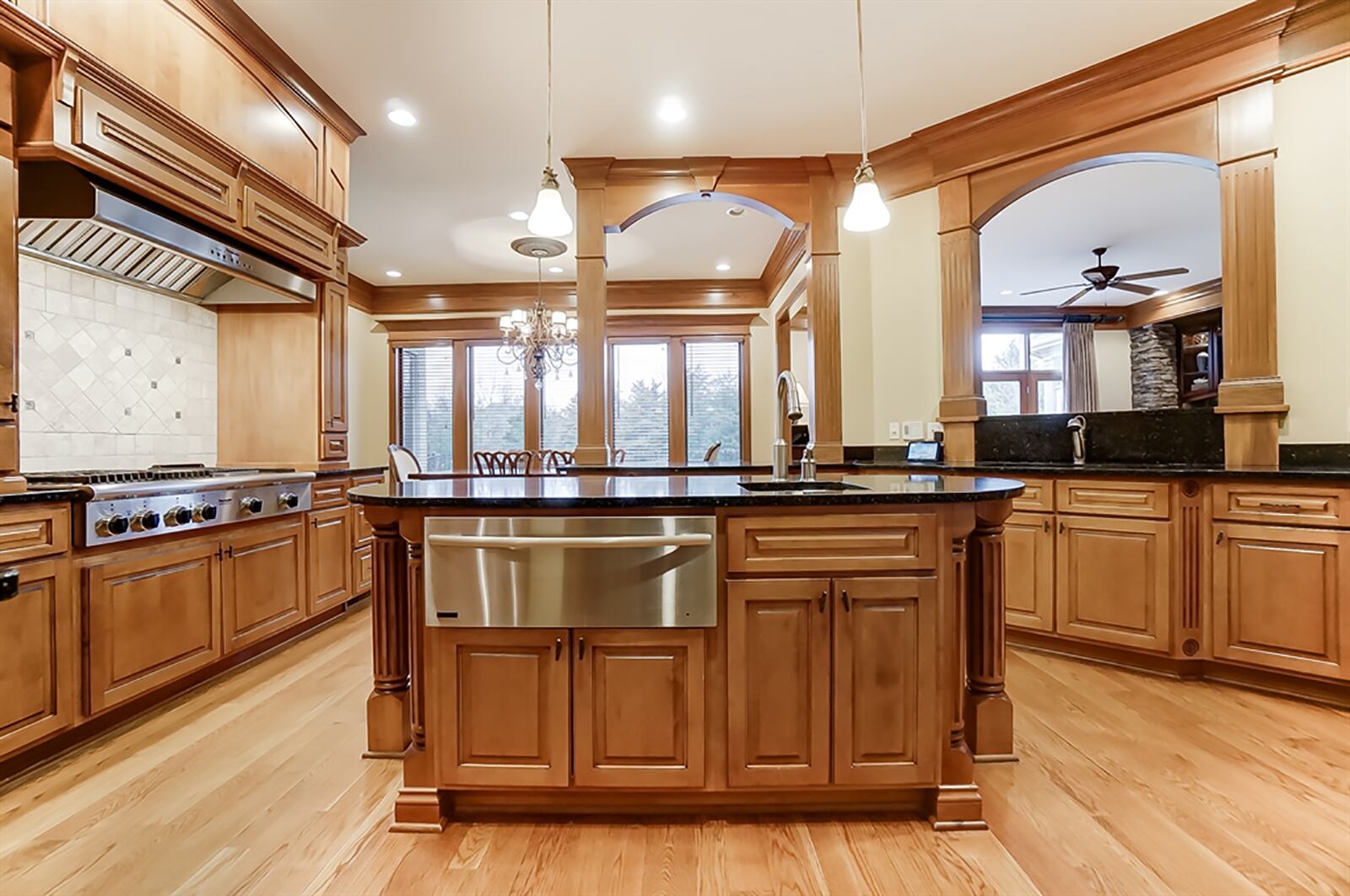 Maple cabinetry encircles the kitchen and offers storage space for nearly every cook’s needs. Quartz countertops provide breakfast bar seating and plenty of workspace, including a coffee station and an oval island with warming drawer. CONTRIBUTED PHOTO
