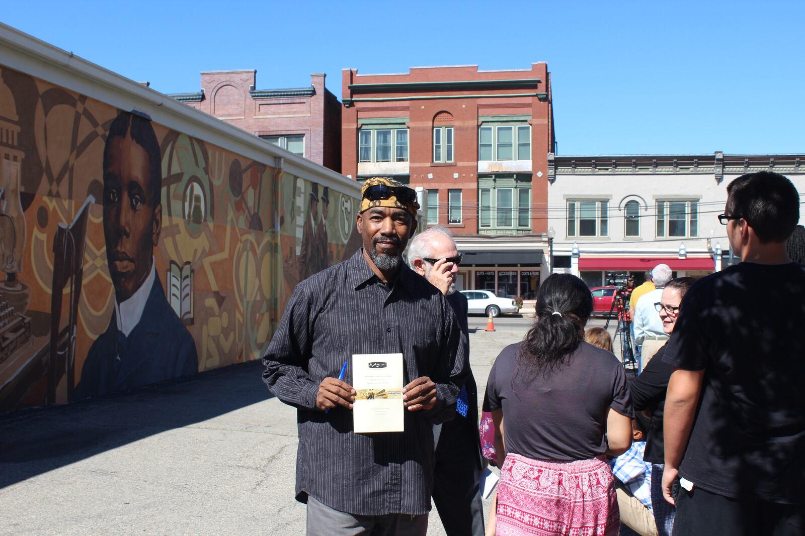 Photo from the dedication of the Dayton  Region's  Walk of Fame mural wall in  Dayton Wright-Dunbar neighborhood. The mural was designed by Dayton artist James Pate. The dedication followed the 2017 walk of fame induction ceremony.   Photo by Amelia Robinson