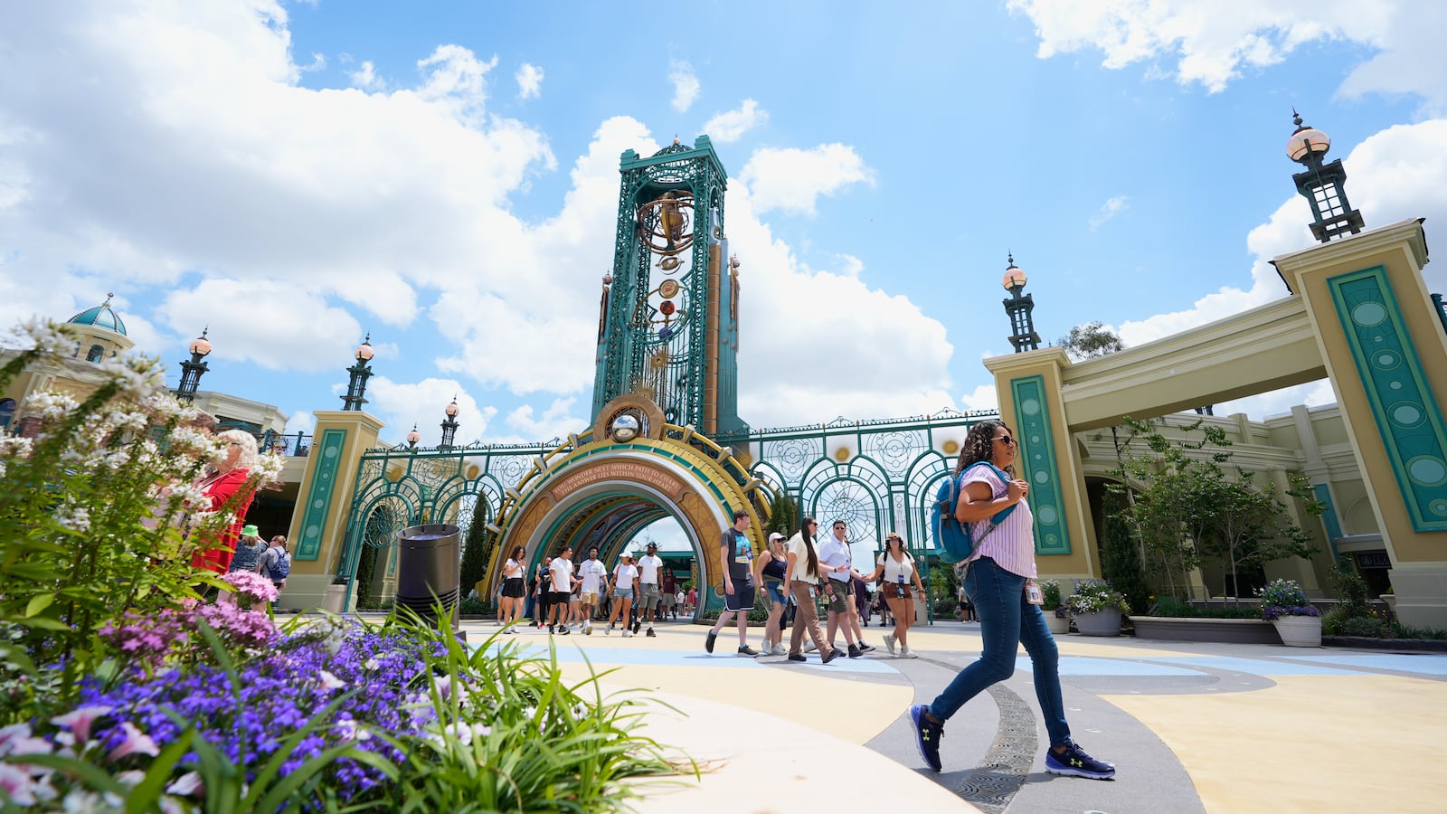 Guests arrive at the main entrance to Epic Universe Theme Park at Universal Resort Orlando Thursday, April 10, 2025, in Orlando, Fla. (AP Photo/John Raoux)
