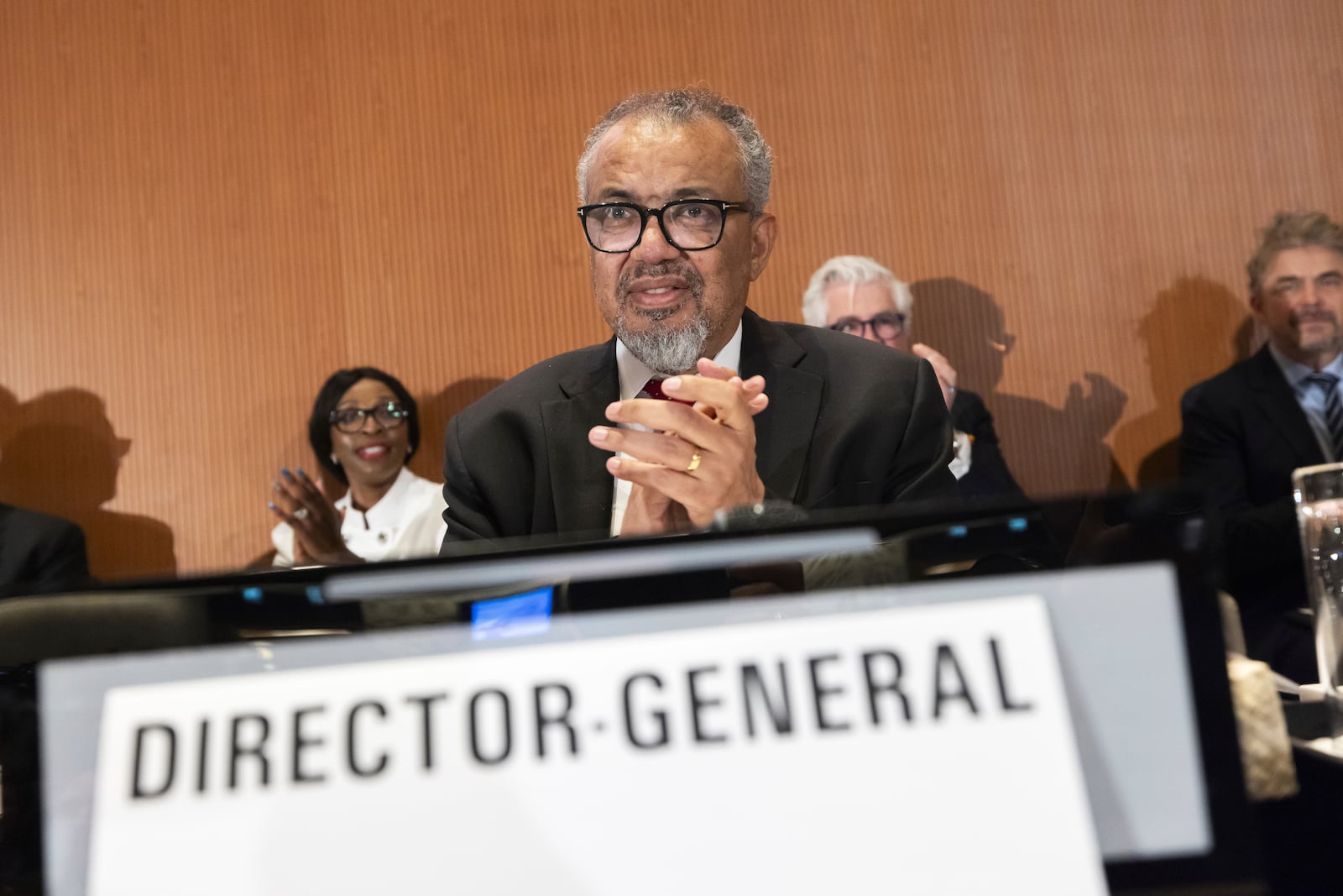 Tedros Adhanom Ghebreyesus, Director General of the World Health Organization (WHO), applauds as member countries approve an agreement to combat future pandemics, during the 78th World Health Assembly (WHA78) at the European headquarters of the United Nations in Geneva, Switzerland, Tuesday, May 20, 2025. (Magali Girardin/Keystone via AP)