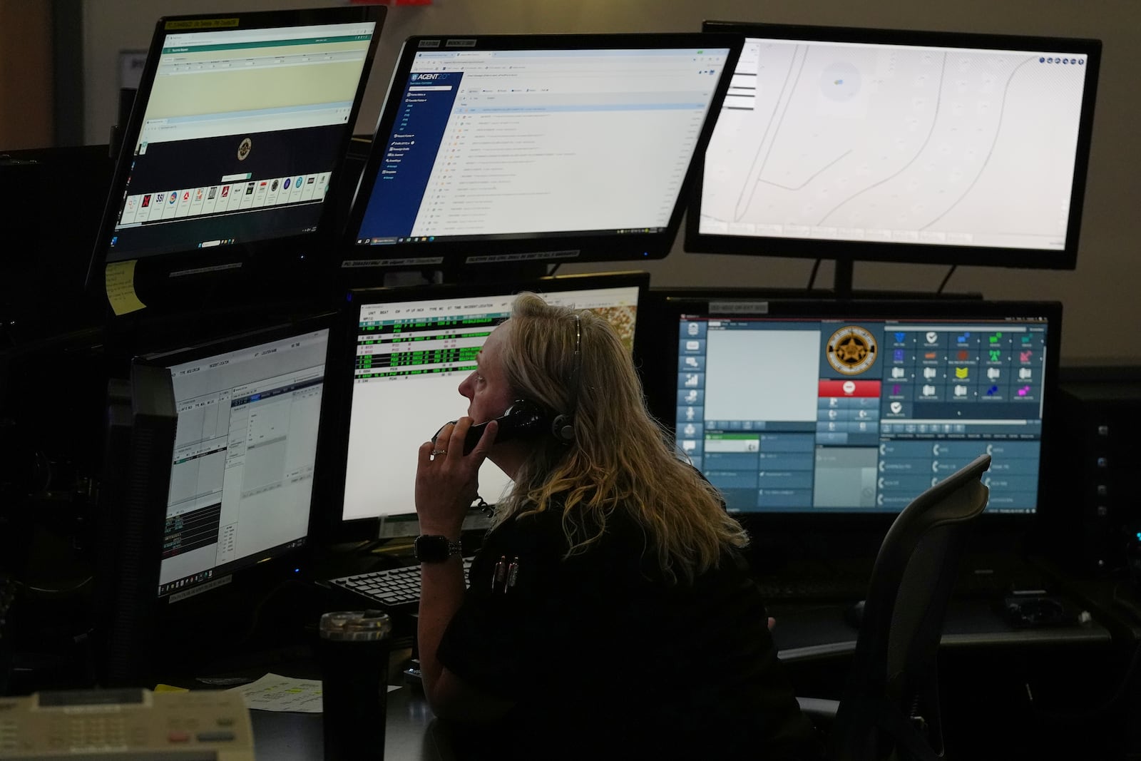 Dispatcher Donna Bocik responds to a 911 call at the Collier County Emergency Services Center, Friday, July 11, 2025, in Naples, Fla. (AP Photo/Marta Lavandier)