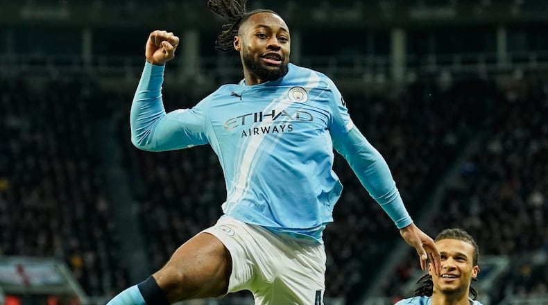 Manchester City's Antoine Semenyo, left, celebrates a goal that was later disallowed by a VAR decision during the English League Cup semifinal first leg soccer match between Newcastle and Manchester City in Newcastle, England, Tuesday, Jan. 13, 2026. (AP Photo/Dave Thompson)