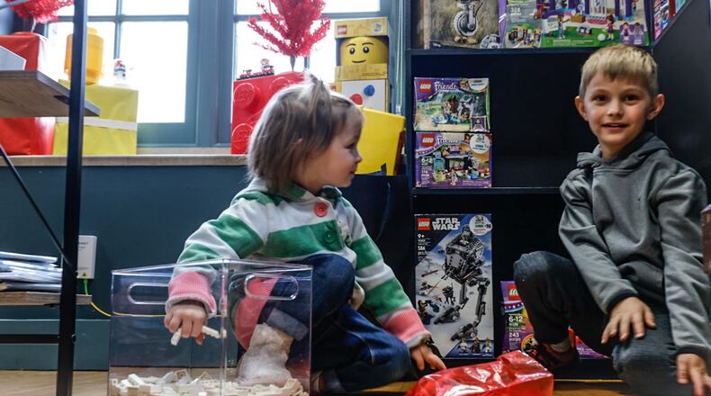 Blake and Beau Swihart, from New Carlisle, play with LEGOS on the of BA Bricks, located at 224 S. Market St. Suite B in Troy. BA Bricks is a locally owned small business that sells LEGOS action-figures along with everything LEGOS. JIM NOELKER/STAFF
