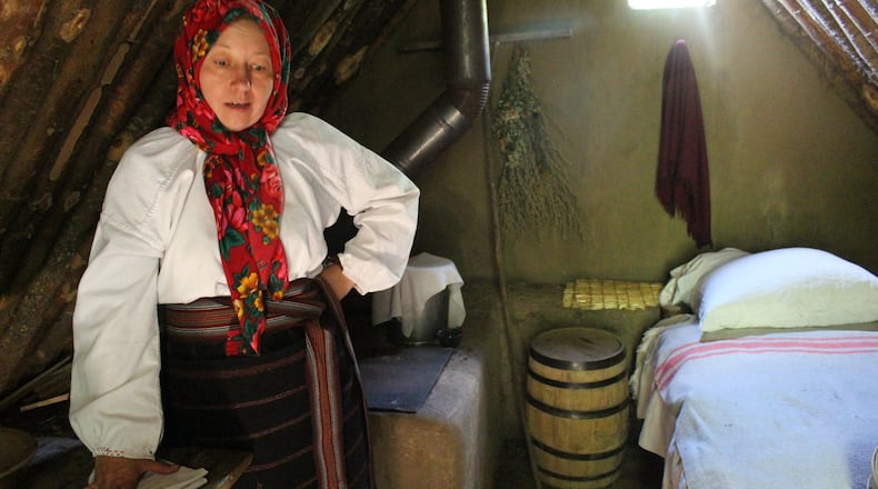Maria, a Ukraine immigrant, explains life as a settler in pre-1900 Alberta from her dugout home at the Ukrainian Cultural Heritage Village, near Edmonton.  (Alan Solomon/Chicago Tribune/TNS)