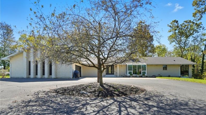 This brick ranch with finished basement in Brookville sits on a nine plus acre lot with stocked pond, a creek, walking trails with bridges and a fenced back yard. CONTRIBUTED