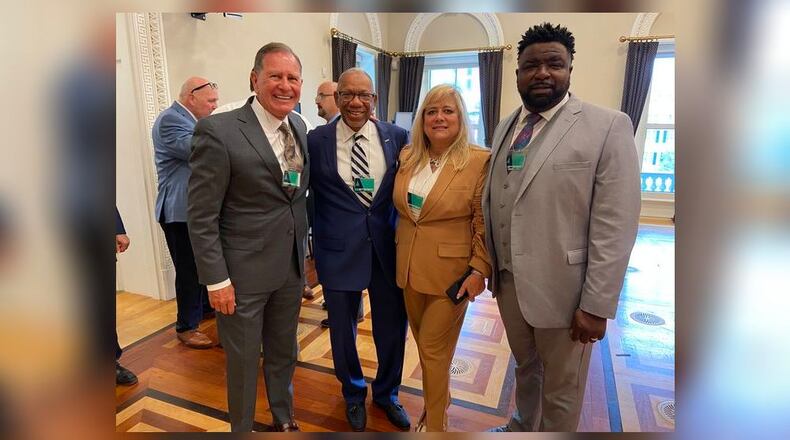 Dayton Mayor Jeff Mims (center left) and Montgomery County Commission President Debbie Lieberman (center right) visited the White House Wednesday to talk to senior administration officials about how federal programs are helping Ohio. Also pictured are Lorain Mayor Jack Bradley (far left) and Youngstown Mayor Jamael Tito Brown (far right).