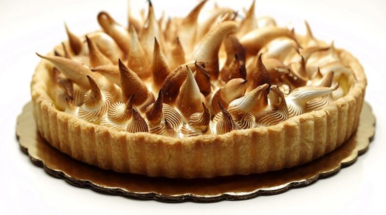 Get out the kitchen torch to brown the spiky meringue you've piped onto the sweet-tart lemon curd. (Joan Moravek/food styling) (E. Jason Wambsgans/Chicago Tribune/TNS)