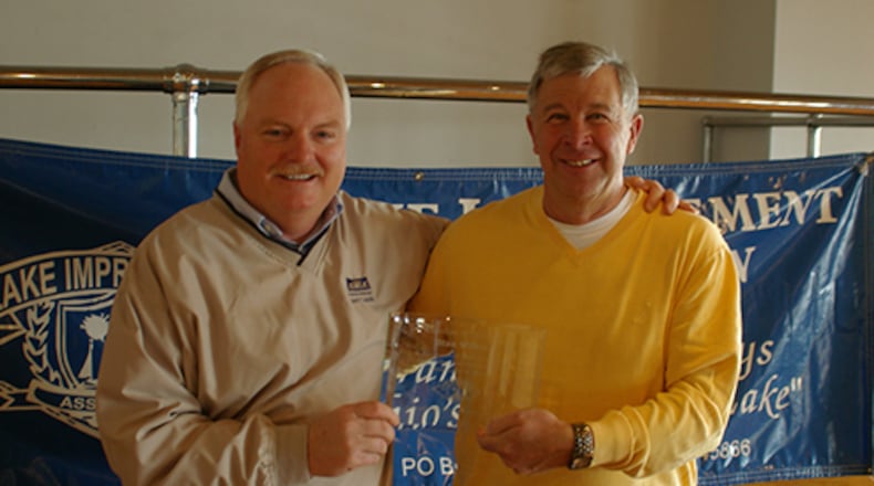 Stan Wilker (right), a longtime teacher and athletic director at Marion Local, died Monday after a long illness. CONTRIBUTED