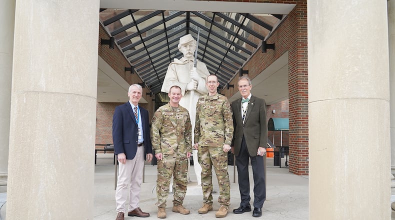 From left: Dr. Bradley Lloyd (retired U.S. Air Force colonel), Dayton VA Medical Center, assistant chief of staff; Dr. (Maj.) Matthew Koroscil, director of the Medical Intensive Care Unit, Wright-Patterson Medical Center; Dr. (Maj.) Andrew Berglund, chief of Pulmonary Medicine, Wright-Patterson Medical Center; and Dr. James Hardy, (retired U.S. Army colonel), Dayton VA Medical Center chief of staff stand outside the Dayton VA in celebration of their resource-sharing partnership that has increased care for veterans at the downtown facility. U.S. AIR FORCE PHOTO/KENNETH STILES