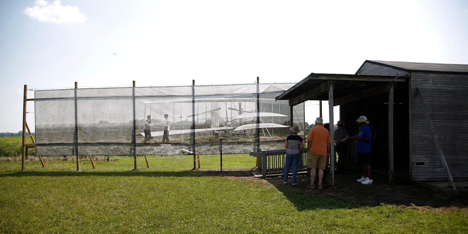 Dan Patterson, Artist in Residence with the Dayton Aviation Heritage National Historical Park had a 1904 image of the Wright Brothers on Huffman Prairie printed on mesh for display on the site of the original photo.  TY GREENLEES / STAFF
