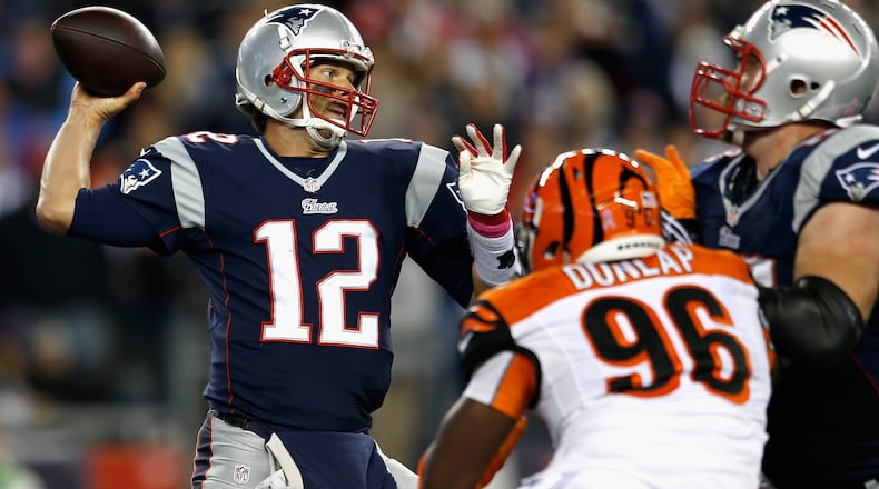 FOXBORO, MA - OCTOBER 05: Tom Brady #12 of the New England Patriots passes during the third quarter against the Cincinnati Bengals at Gillette Stadium on October 5, 2014 in Foxboro, Massachusetts. (Photo by Jim Rogash/Getty Images)