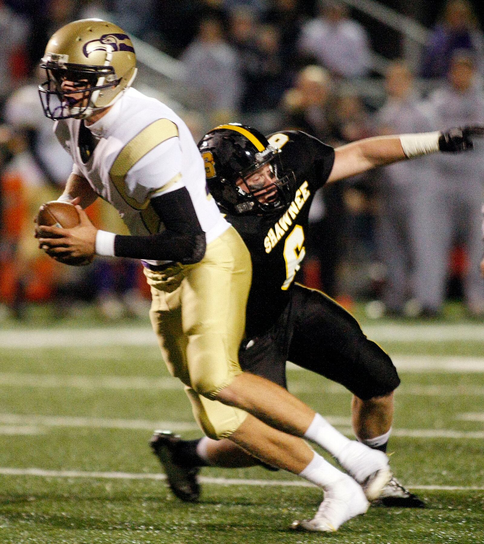 Alex McCrory (6) of Shawnee tackles Eaton quarterback Cole French (7) during Saturday's Division III regional semifinal football game at Northmont High School on Nov. 13, 2010. 
Staff Photo by Barbara J. Perenic
