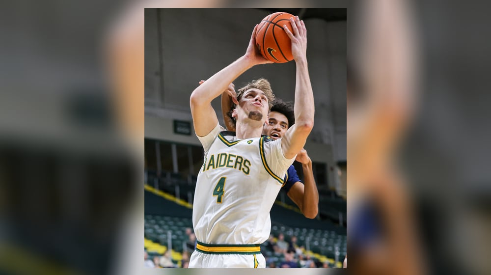 Wright State freshman forward Kellen Pickett shoots with pressure from Franklin College's Dylan Beverly during a nonconference game on Monday, Nov. 3 at Ervin J. Nutter Center in Fairborn. Pickett scored seven points and had five rebounds and three assists. BRYANT BILLING/STAFF
