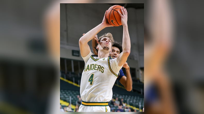 Wright State freshman forward Kellen Pickett shoots with pressure from Franklin College's Dylan Beverly during a nonconference game on Monday, Nov. 3 at Ervin J. Nutter Center in Fairborn. Pickett scored seven points and had five rebounds and three assists. BRYANT BILLING/STAFF