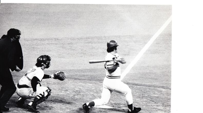 Pete Rose hits a single to right in the 1975 World Series. Rose, a switch hitter, remains the all-time Major League leader in hits with 4,256.
