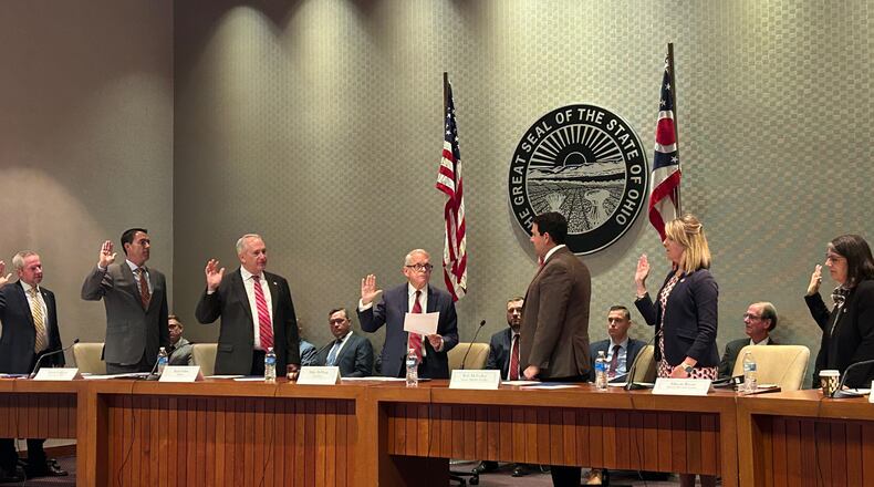 Members of the Ohio Redistricting Commission are sworn in by Gov. Mike DeWine on Sept. 13, 2023.