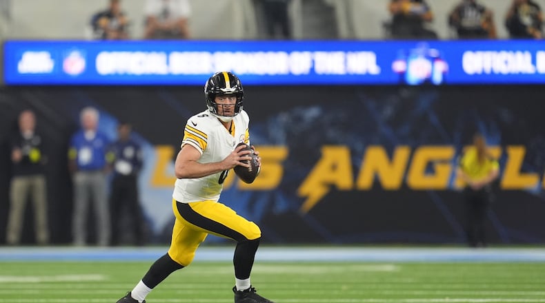 Pittsburgh Steelers quarterback Aaron Rodgers (8) pulls back to throw a pass during the first half of an NFL football game against the Los Angeles Chargers Sunday, Nov. 9, 2025, in Inglewood, Calif. (AP Photo/Marcio Jose Sanchez)