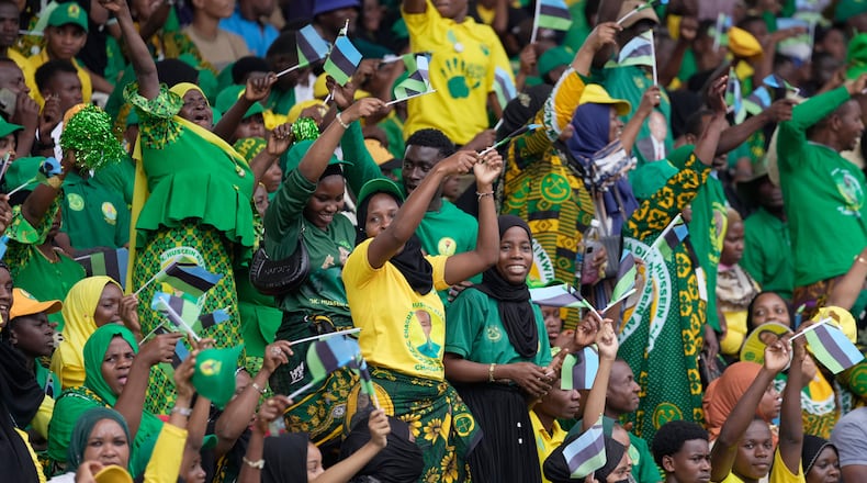 Supporters of the ruling Chama Cha Mapinduzi (Revolutionary Party) sing during the inauguration of Zanzibar President elect Hussein Ali Mwinyi at Amaan Stadium in Zanzibar, Tanzania, Saturday, Nov. 1, 2025. (AP Photo/Brian Inganga)