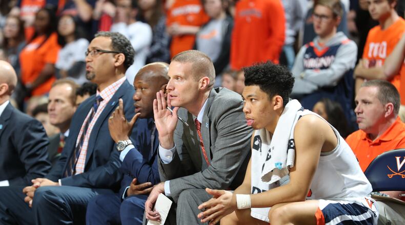 Miamisburg grad Kyle Getter (second from right) on the Virginia bench. CONTRIBUTED