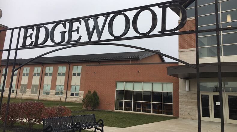 A written threat in a boys restroom led to a 50-minute lock down at Edgewood High School Friday until police determined it was safe to resume classes.