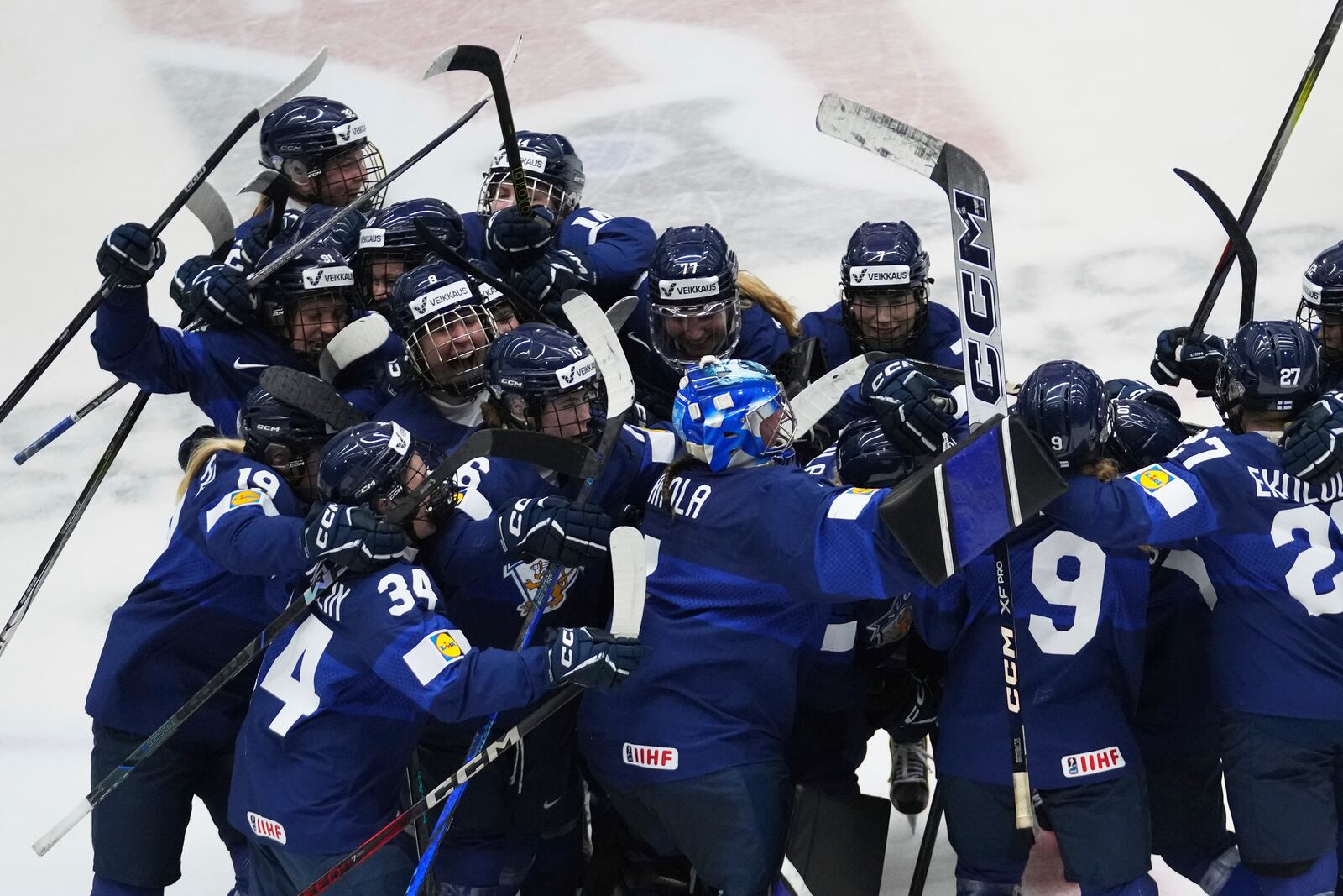 Finland's players celebrate after winning the bronze medal match between Czech Republic and Finland at the Women's Ice Hockey Championships in Ceske Budejovice, Czech Republic, Sunday, April 20, 2025. (AP Photo/Petr David Josek)