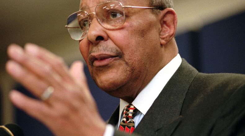 FILE - In this Saturday, Jan. 17, 1998, file photo, Rep. Louis Stokes, D-Ohio, announces, at the Carl B. Stokes Social Services Mall in Cleveland, that he will retire from Congress at the end of the year. Stokes, a 15-term Ohio congressman who took on tough assignments looking into assassinations and scandals, died late Tuesday, Aug. 18, 2015. Stokes was 90. (AP Photo/Tony Dejak, File)