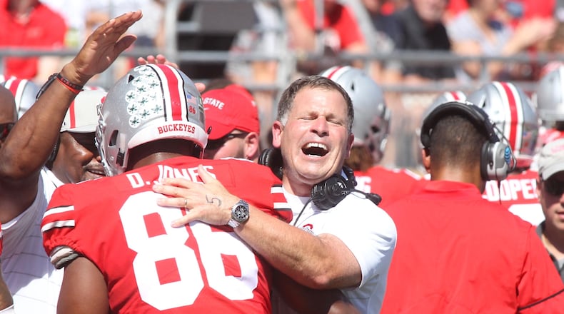 Ohio State’s Greg Schiano hugs Dre’Mont Jones after he recorded a safety against UNLV on Saturday, Sept. 23, 2017, at Ohio Stadium in Columbus. David Jablonski/Staff