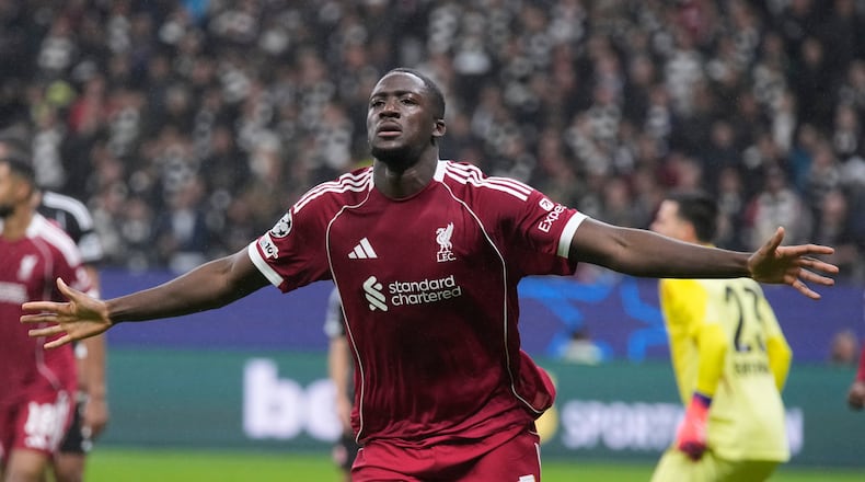Liverpool's Ibrahima Konate celebrates after scoring his side's third goal during the Champions League opening phase soccer match between Eintracht Frankfurt and Liverpool in Frankfurt, Germany, Wednesday, Oct. 22, 2025. (AP Photo/Michael Probst)