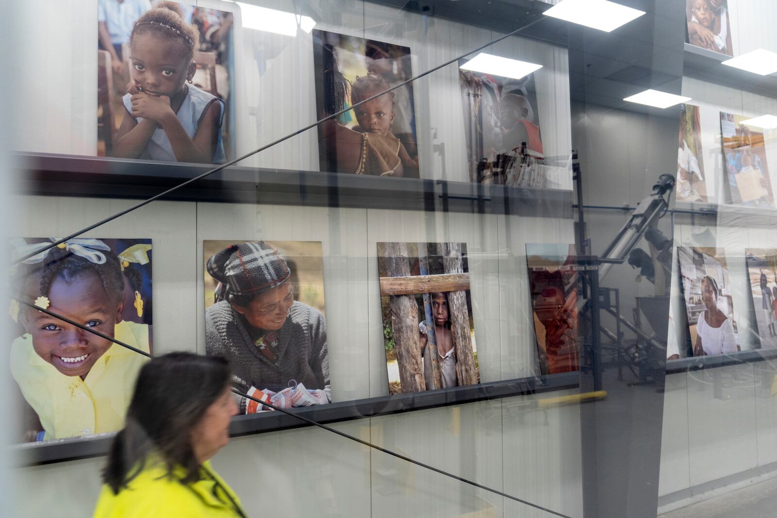 Photos from the travels of Edesia Nutrition CEO Navyn Salem are displayed in the company's North Kingstown, R.I. facility, Friday, March 14, 2025. (AP Photo/David Goldman)