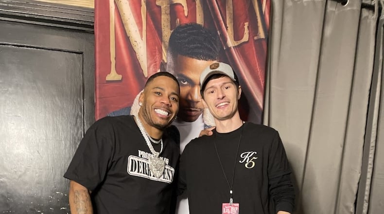 Grammy-winning musician Nelly (left) poses with Bluegrass Farmaceuticals Chief Technology Officer Jonathan Tumey following a Nov. 21, 2021 concert in Waco, Texas. Nelly partners with with Bluegrass Farmaceuticals, which has a Miamisburg location. CONTRIBUTED PHOTO