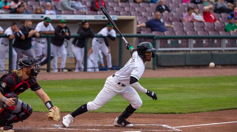 Dayton's Jonathan Willems taps a ball foul during Saturday night's game against Lansing at Day Air Ballpark. Jeff Gilbert/CONTRIBUTED
