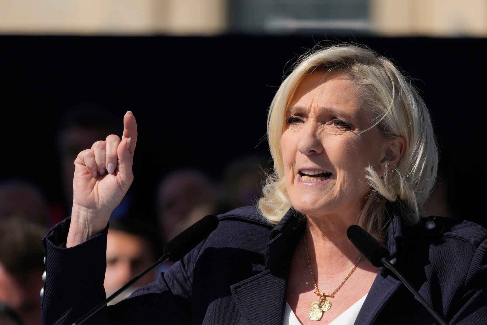 French far-right leader Marine Le Pen delivers her speech during the French far-right party national rally near the parliament in Paris, Sunday, April 6, 2025. (AP Photo/Michel Euler)