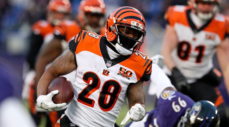 BALTIMORE, MD - DECEMBER 31: Running Back Joe Mixon #28 of the Cincinnati Bengals carries the ball in the first quarter against the Baltimore Ravens at M&T Bank Stadium on December 31, 2017 in Baltimore, Maryland. (Photo by Todd Olszewski/Getty Images)