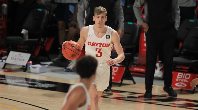 Dayton's Luke Frazier dribbles against Rhode Island in the Atlantic 10 tournament on Thursday, March 4, 2021, at the Siegel Center in Richmond, Va. David Jablonski/Staff